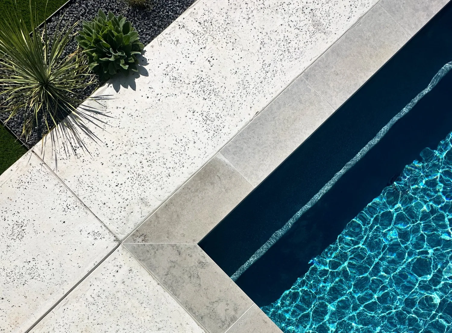 A Pool Sharp build seen from above — the deck, coping, and material details laid out across the lot.